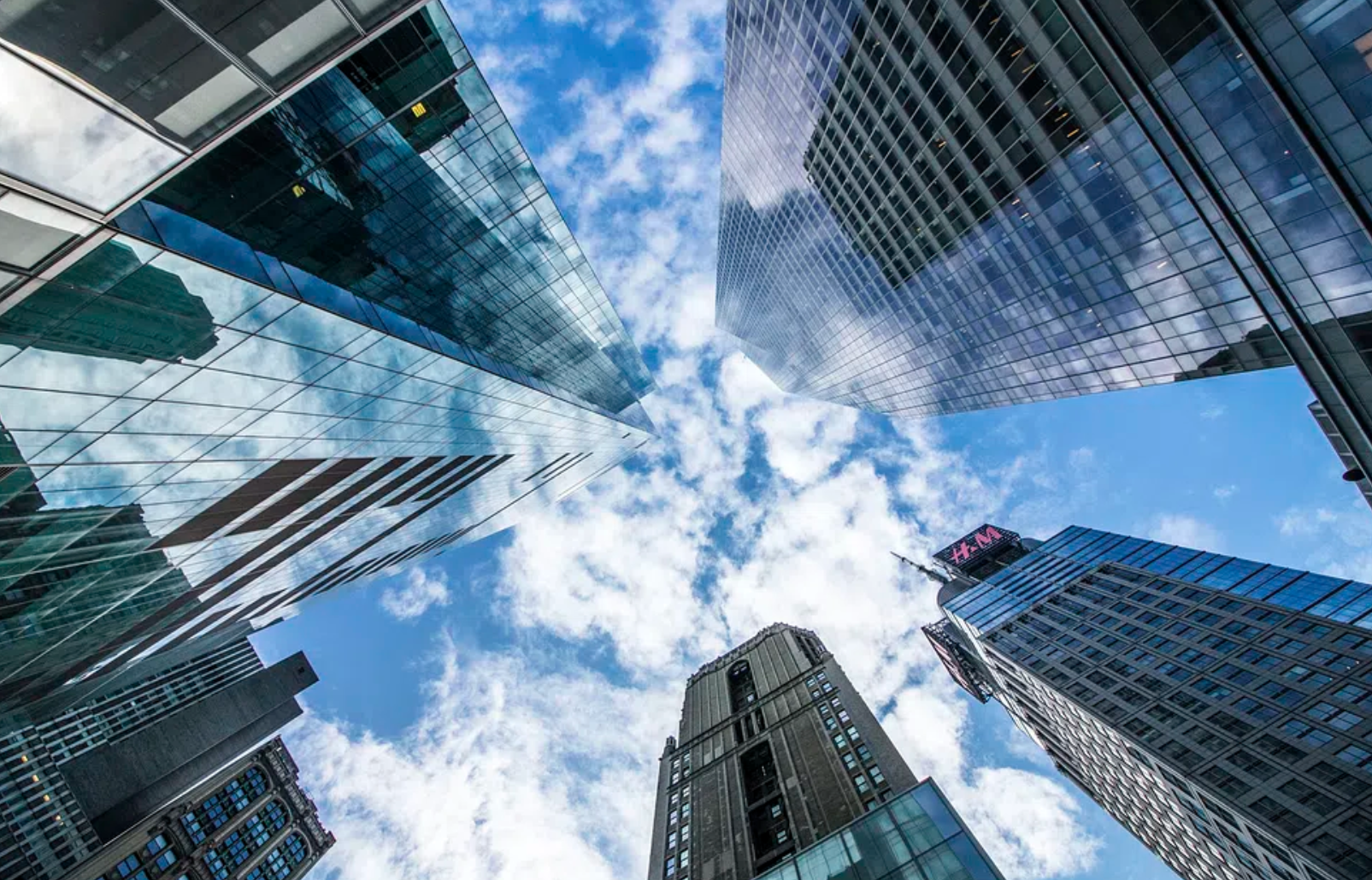 View of downtown skyscrapers looking up.  Generated from Microsoft Designer.